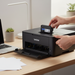 Brother LC103BK black ink cartridge being installed in Brother inkjet printer